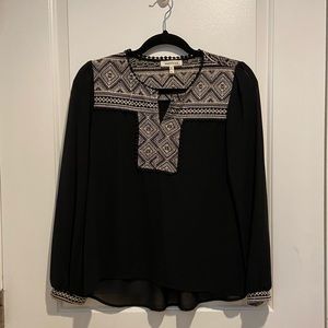 Dressy black and decorative top.